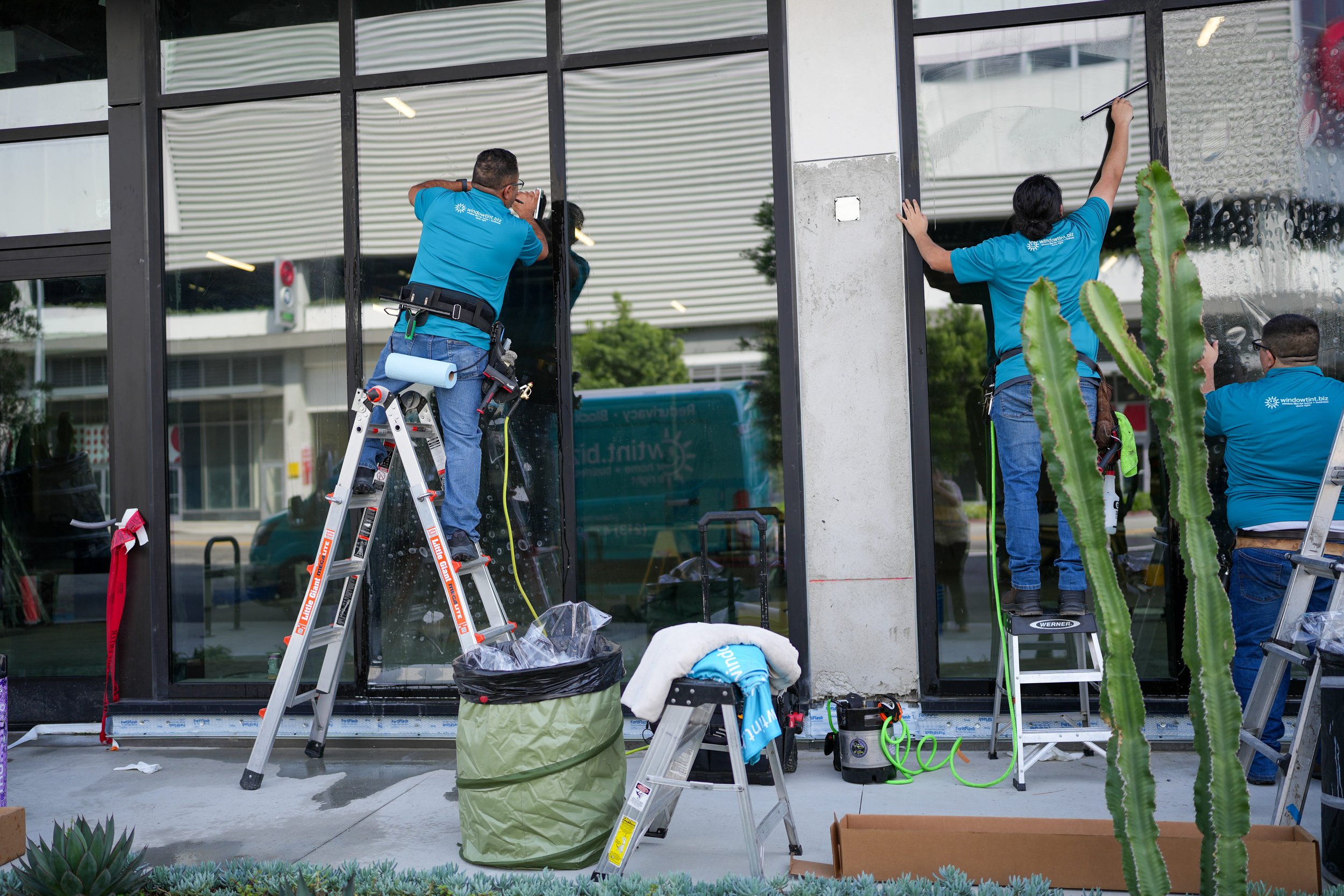 Crew working beside storefront windows
